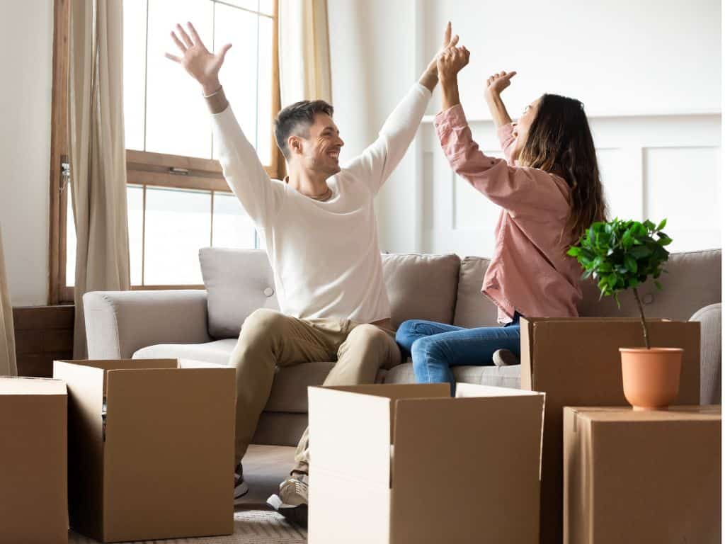Two new tenants who are celebrating moving into their new home.